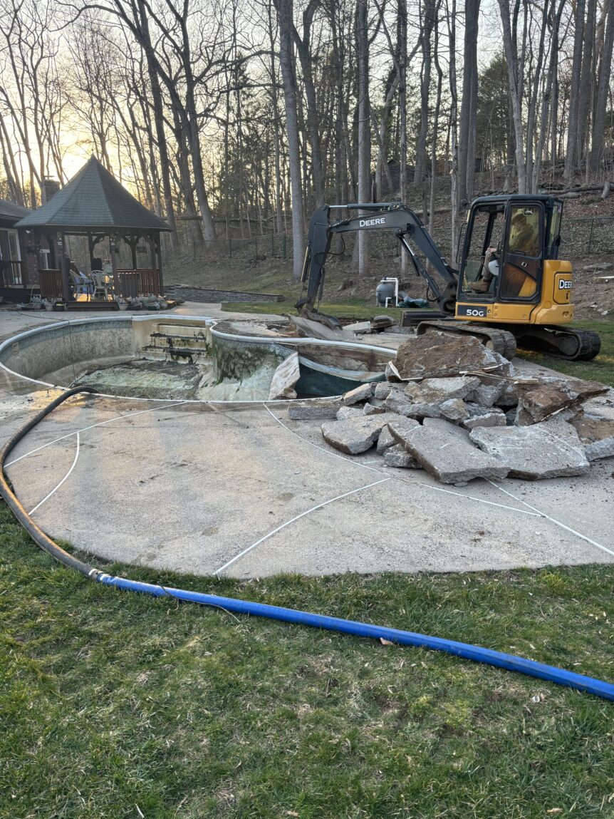 North Branford CT in-ground pool removal with patio demo and restoration