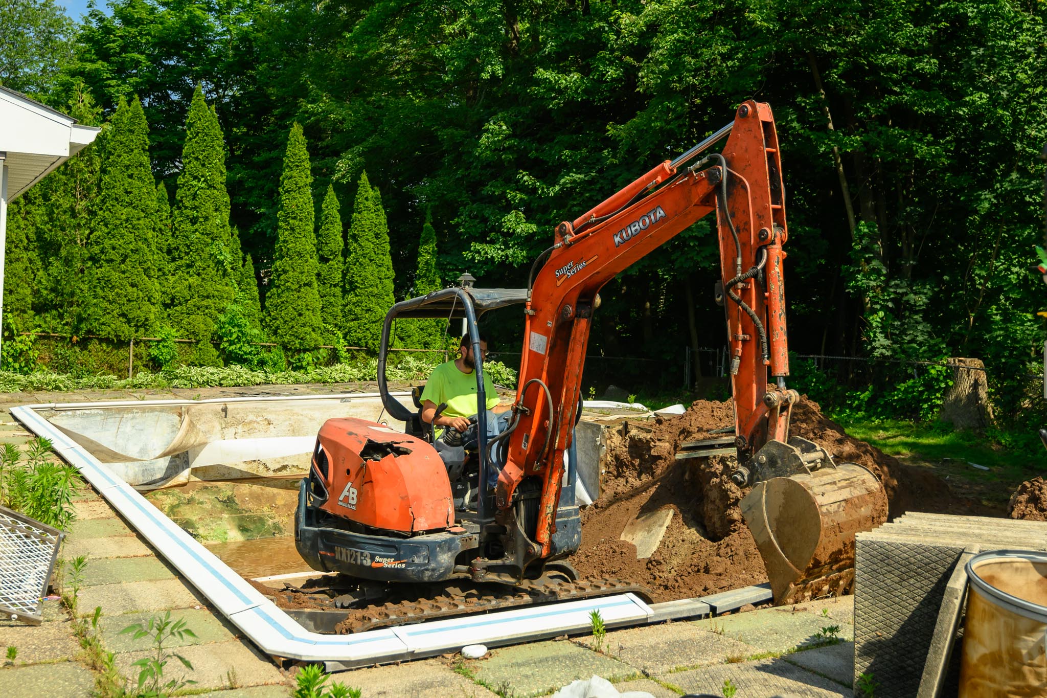 In-ground pool removal project in Bristol CT - equipment on site