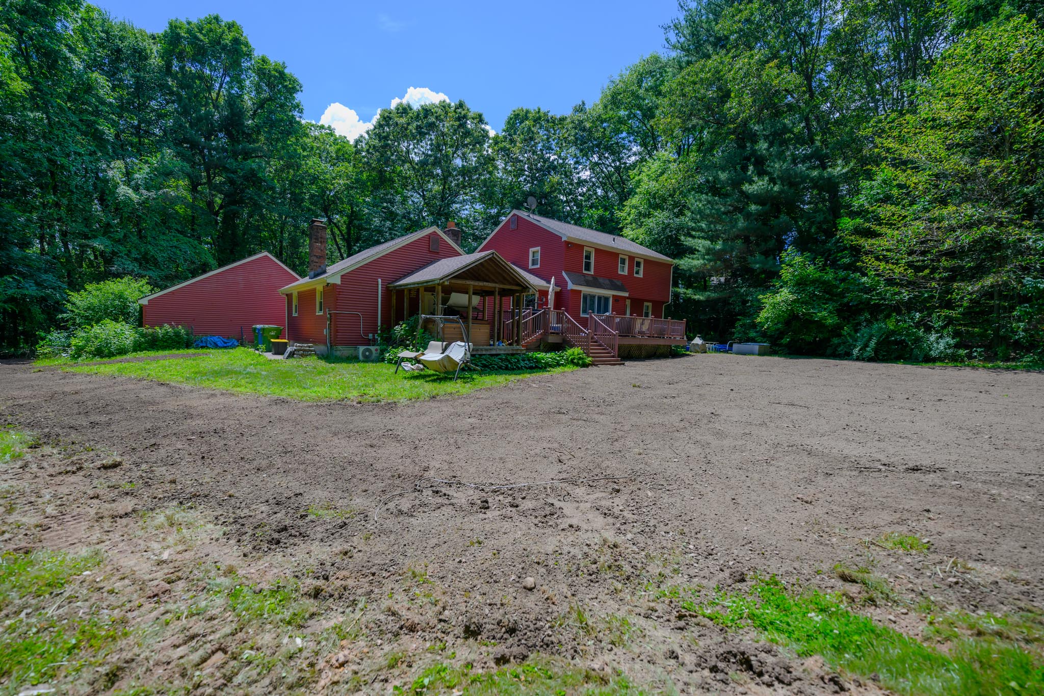 After pool removal in Glastonbury CT showing restored and graded yard space